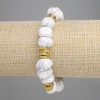 Bracciale in kaolinite sfaccettato, diametro 10-14×7-10 mm ±, con inserti metallici, lunghezza 18 cm ±, elastico