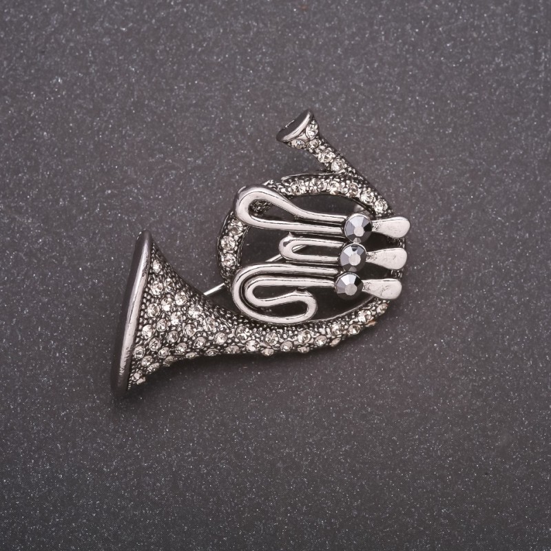 Spilla «Tromba in strass» metallo grigio 42×45 mm